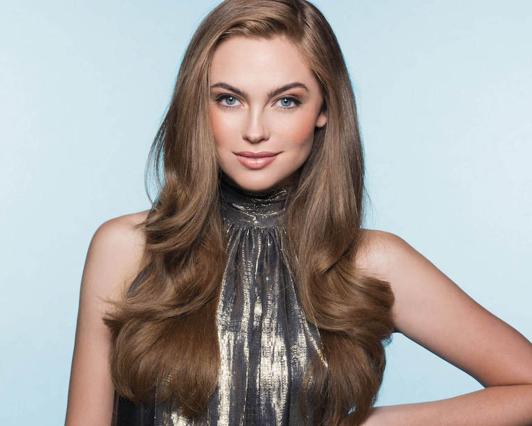 Kenra brand model showcasing hair care products