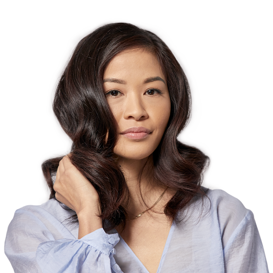 model with long wavy hair showing off her hair color